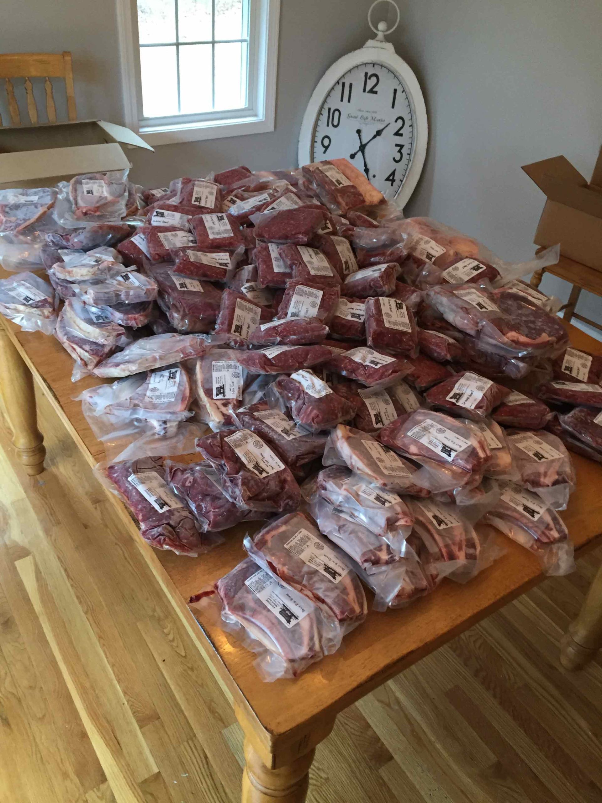 A full custom-cut side, vacuum packed and laid out on a kitchen table